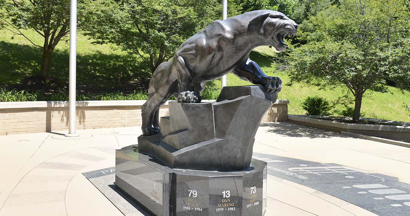 Pittsburgh Panther statue in front of green trees in background