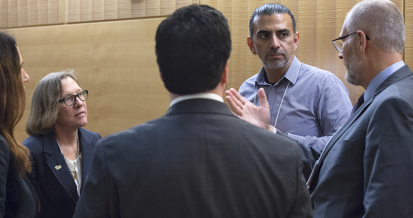 Five people in group having a discussion