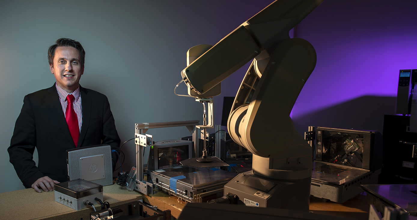 Sejdic standing near a microscope