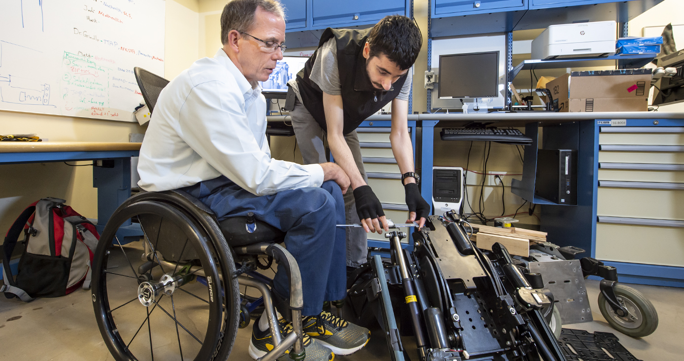 two men working on a device
