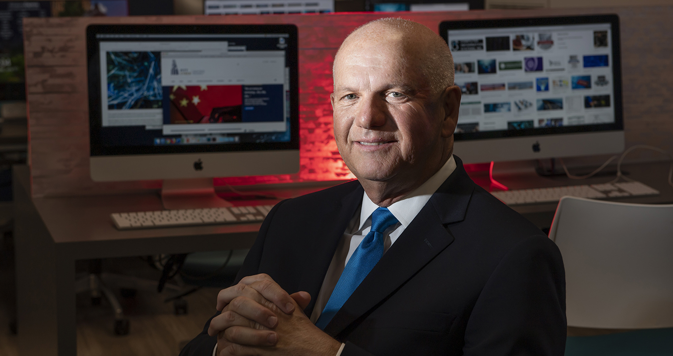 David Hickton in a black suit and blue tie