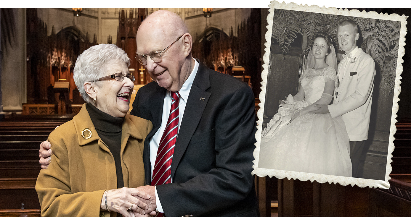 Roger Glunt in a black suit and red tie, holding hands and laughing with Lee Glunt, his wife, wearing a tan jacket. 