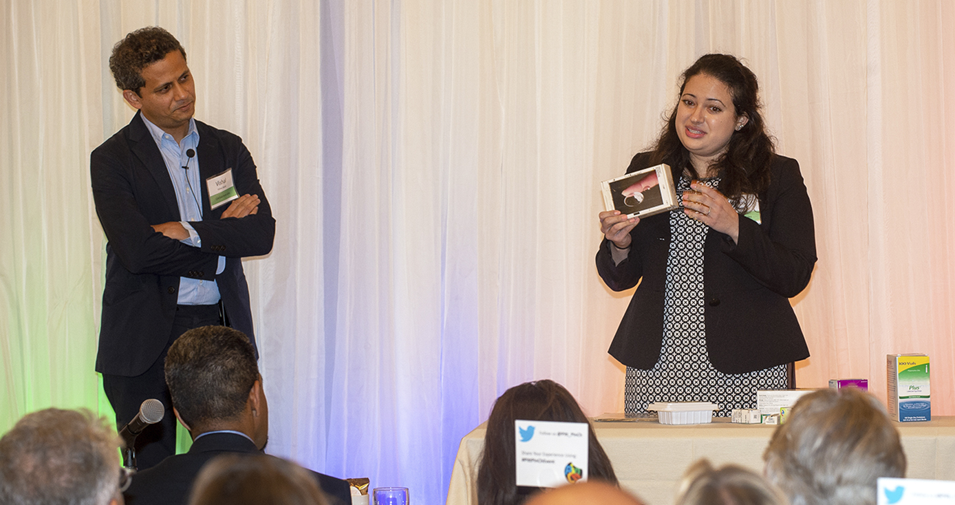 Vishal Jhani of the School of Medicine (left) and Swanson School of Engineering graduate Alexis Nolfi (right) speaking to an audience