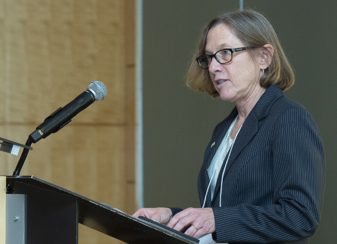 Ann E. Cudd speaking at a lectern