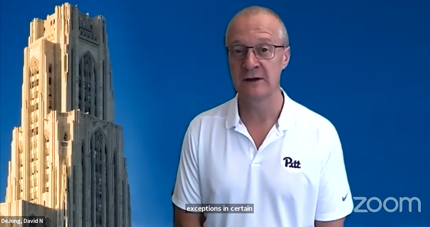 A man in a white golf shirt with a blue background