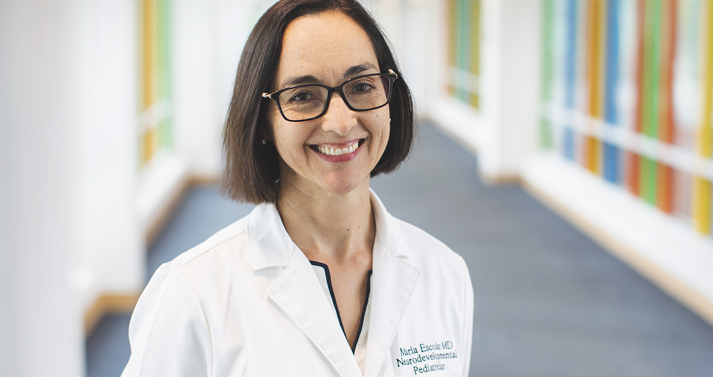 Maria Escolar in a white coat 