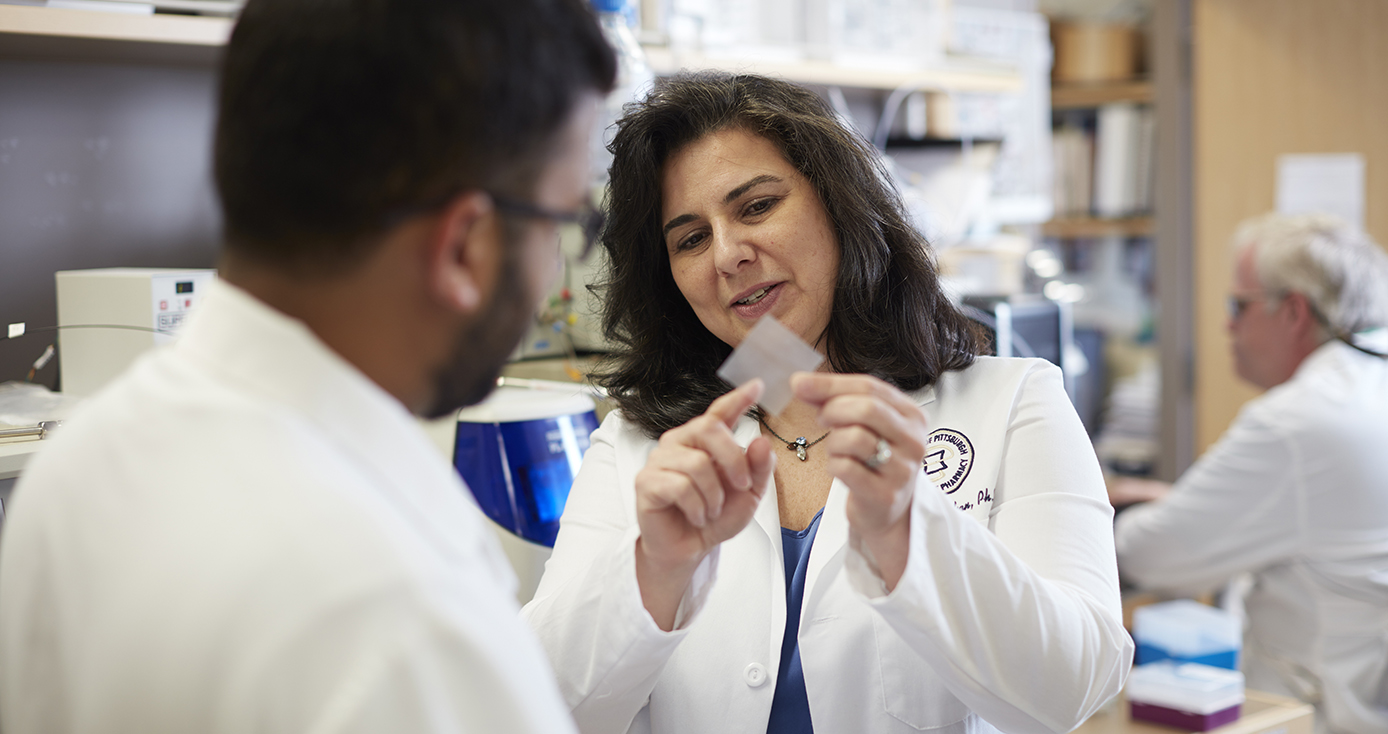 Lisa Rohan in a white coat 