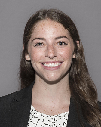 A woman in a dark suit jacket