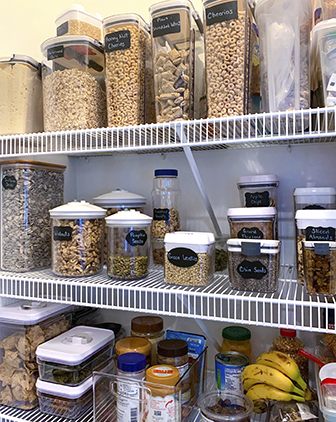 A pantry stocked with containers of whole grains and other ingredients