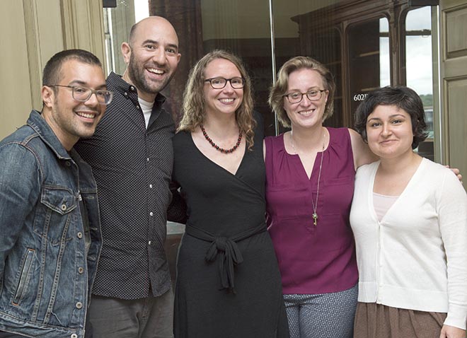 Group of five graduate students standing