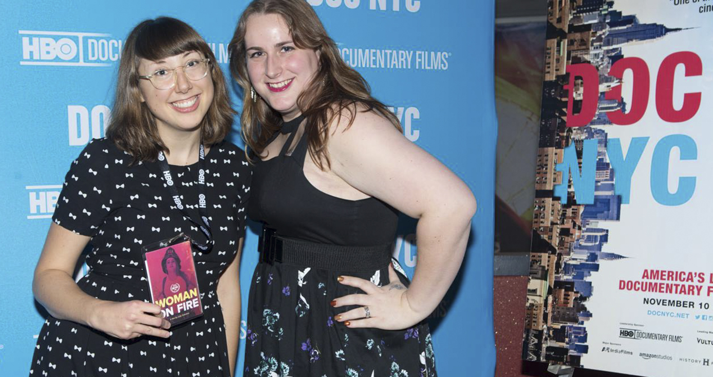 Sokolow and Guinan in front of a red carpet backdrop