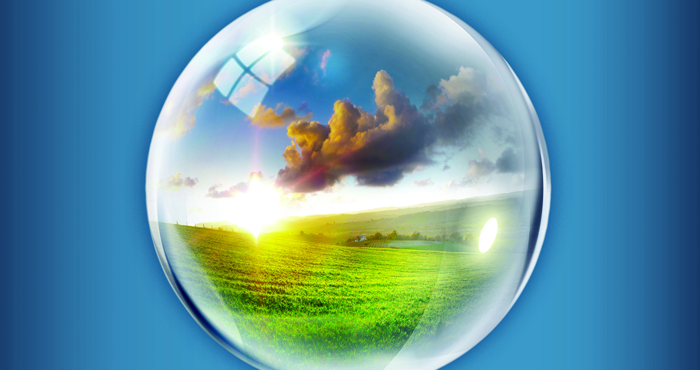 A depiction of a globe with a field and clouds within