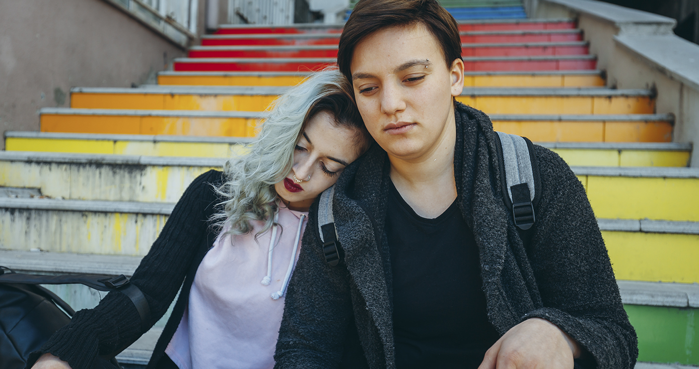 Youths sitting on stairs together