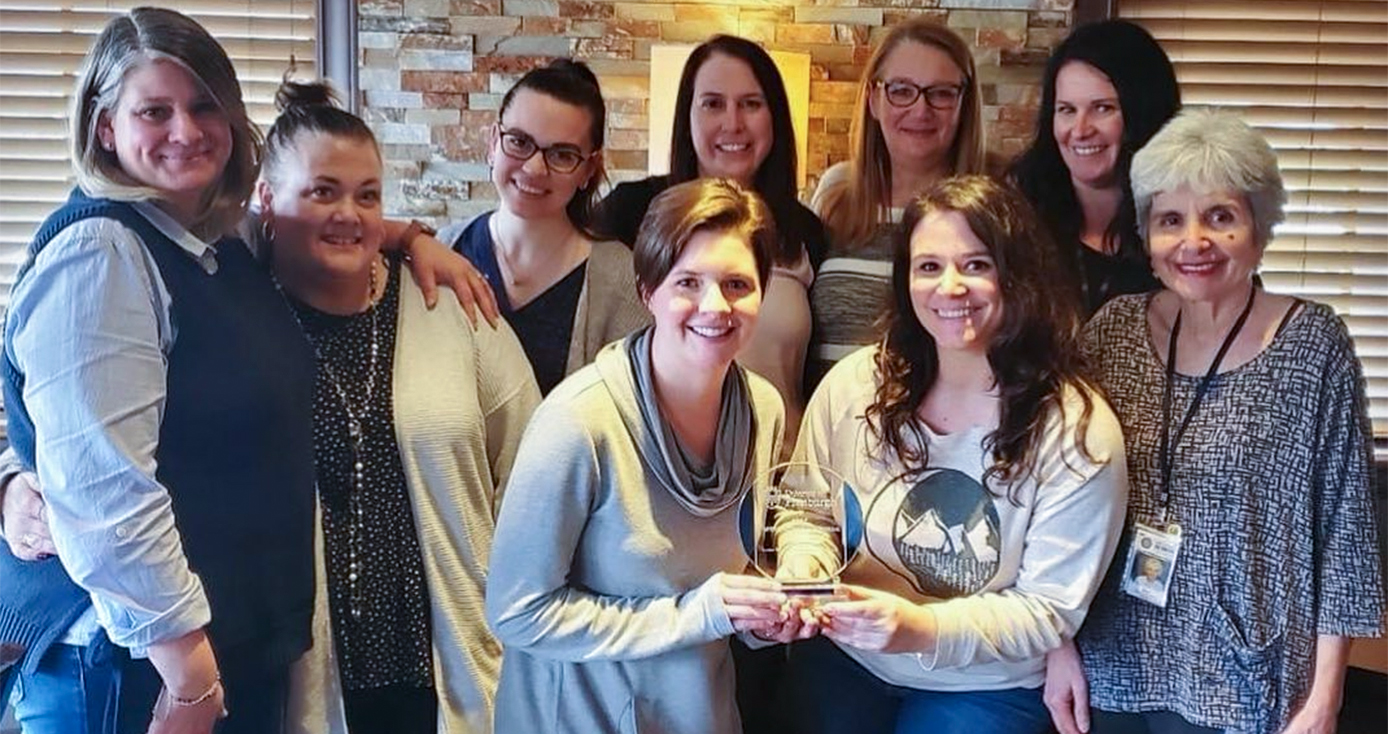 a group of women smiling