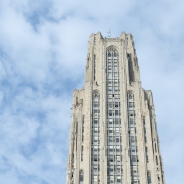 Cathedral of Learning against blue sky with clouds
