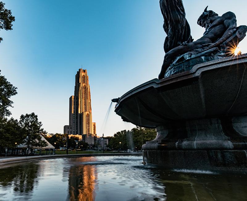 The Cathedral of Learning in the background of a decorative fountain