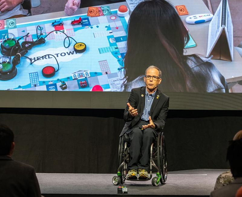 Rory Cooper speaking in front of an audience