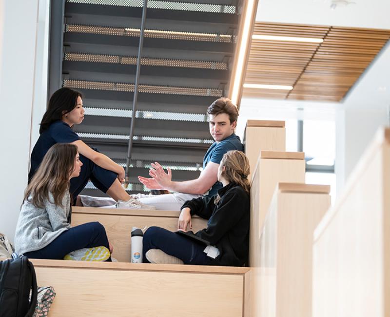 Four students sit in a Scaife Lounge