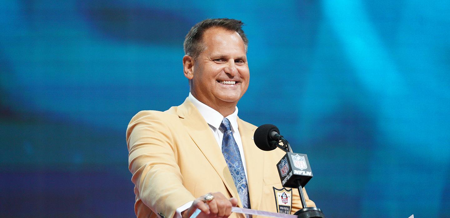 Jimbo Covert in a tan suit