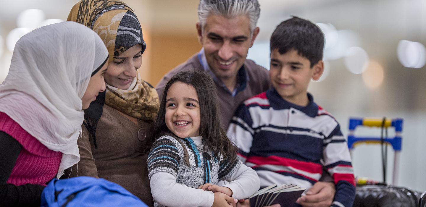 a smiling family sitting together