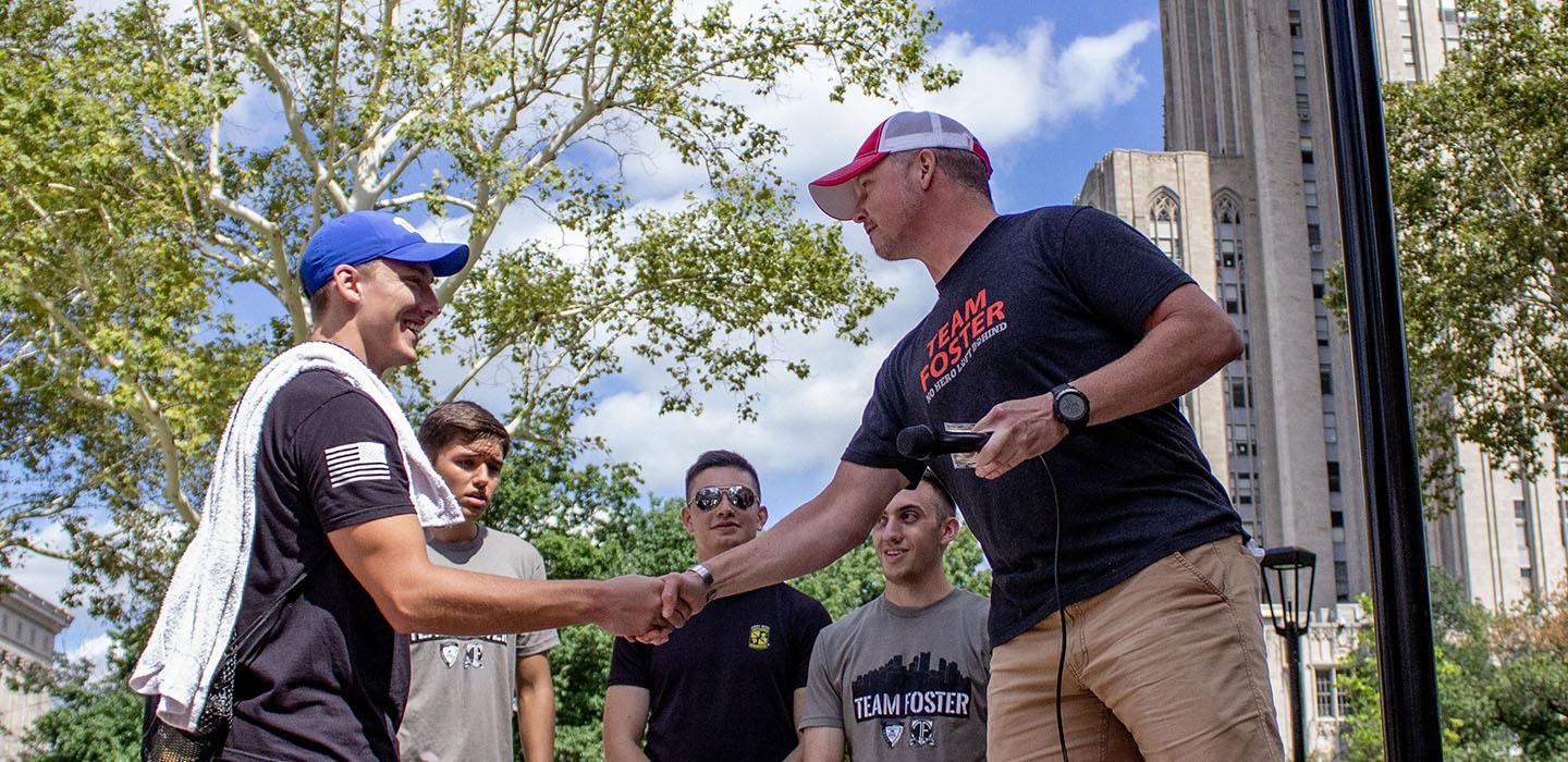 two men shaking hands outside of the Cathedral