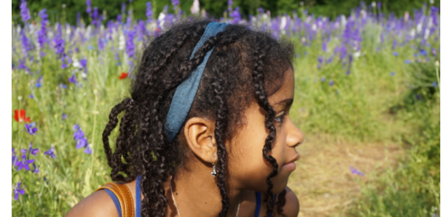 Girl in a field of purple flowers