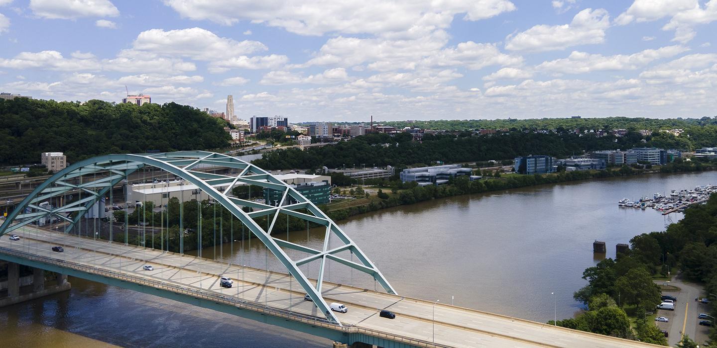 Blue bridge over a river in Pittsburgh