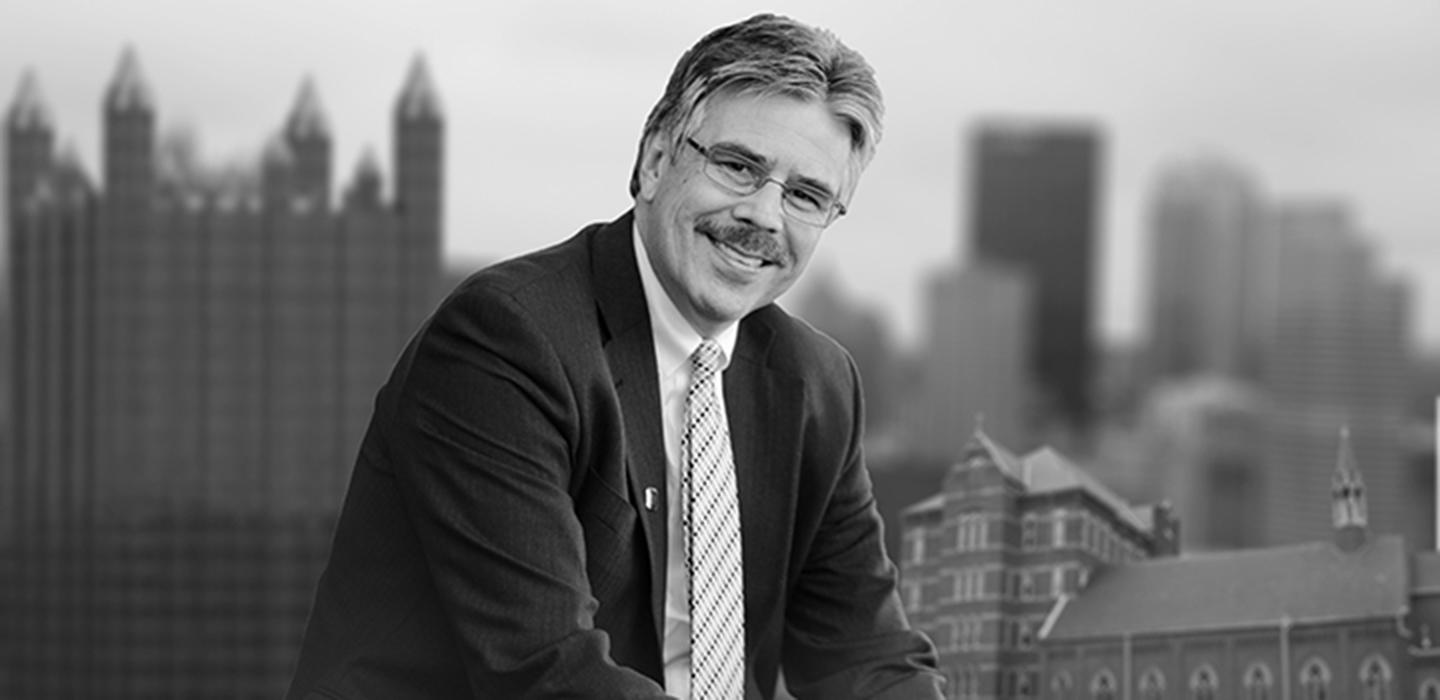 Ken Gormley with Pittsburgh buildings in background
