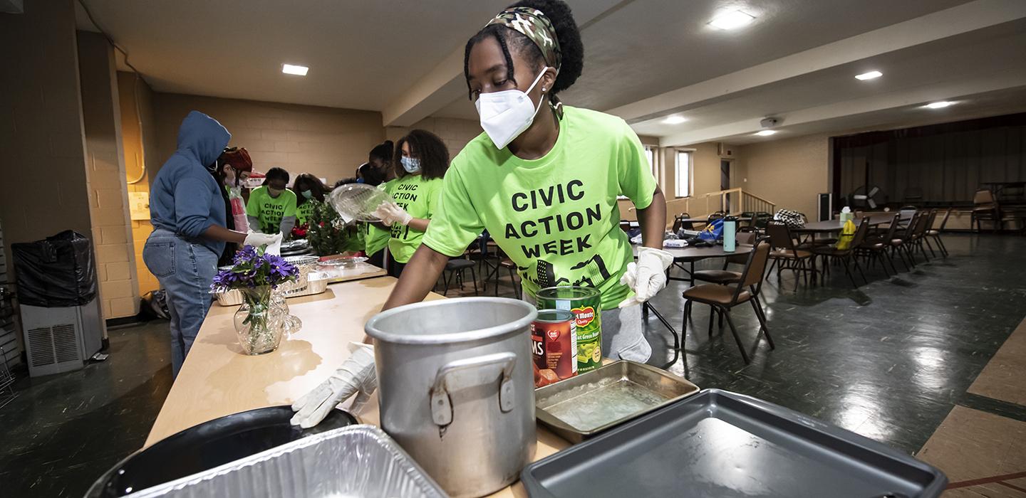Pitt volunteers preparing food during Civic Action Week
