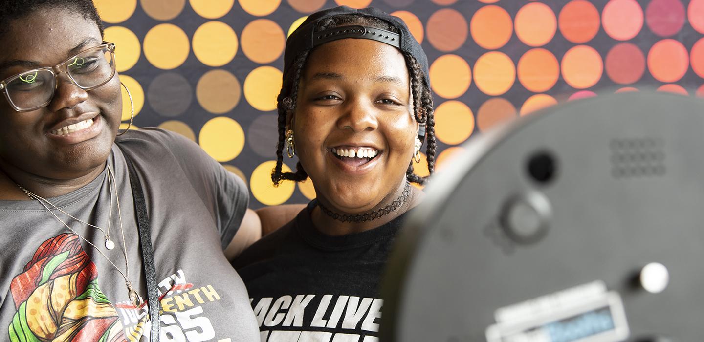 Two people smiling and celebrating Juneteenth