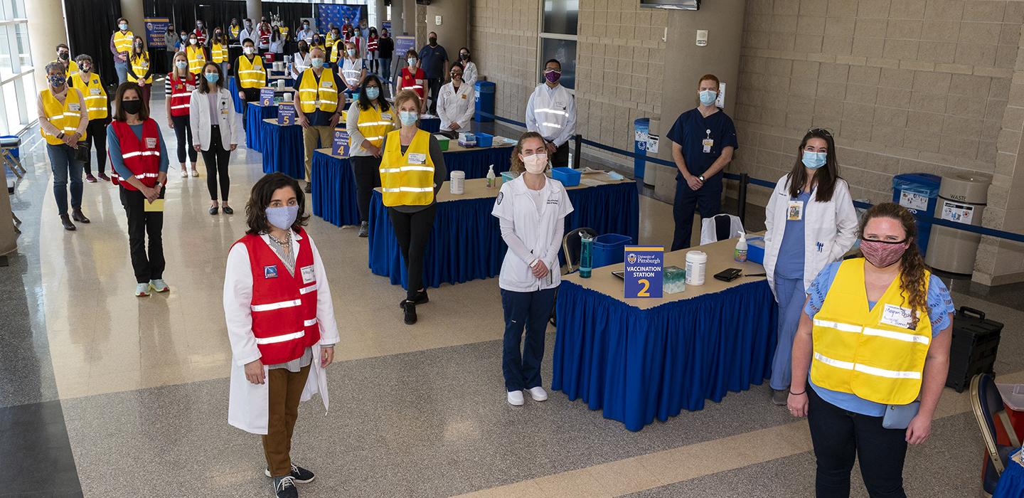Vaccine Clinic volunteers all looking at camera