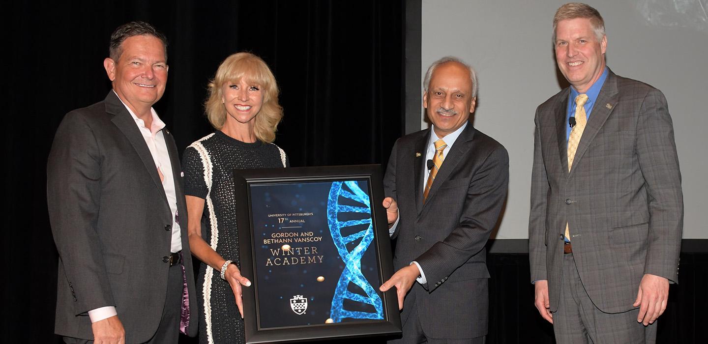 Bethann and Gordon J. Vanscoy holding award.