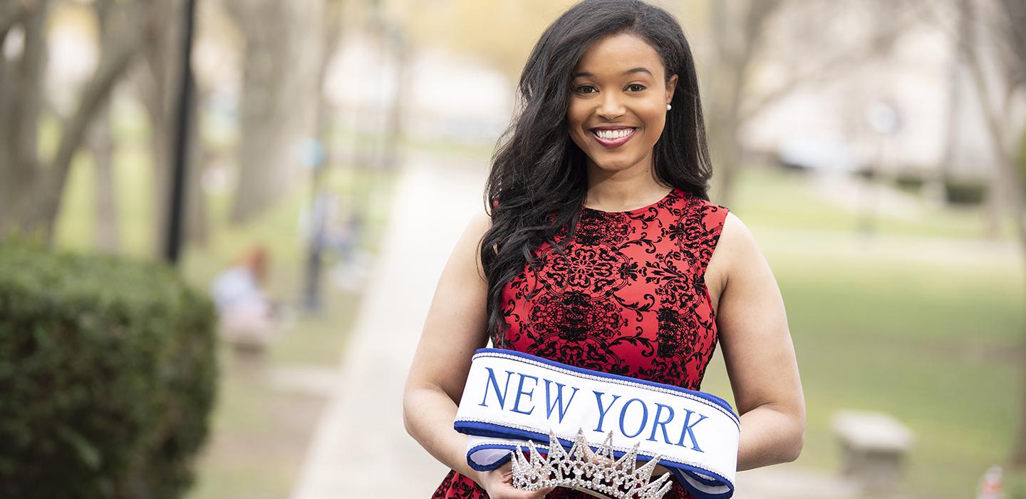 Thais Ridgeway in red dress with Miss New York crown