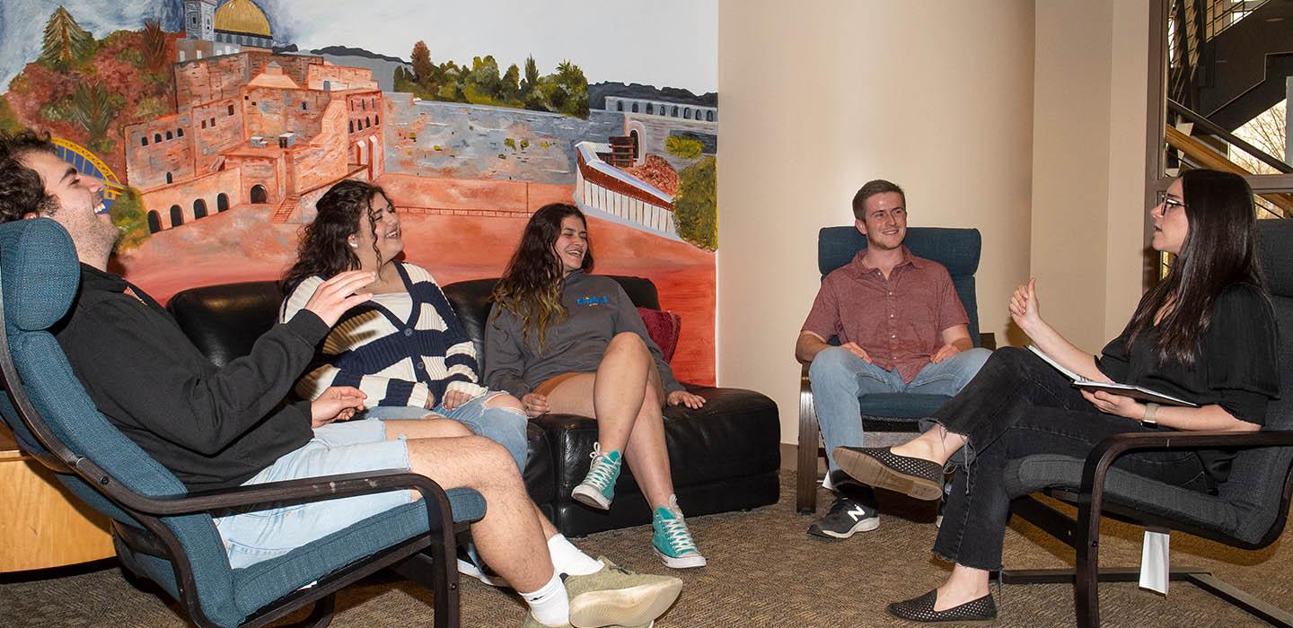 a group of students conversing in a circle
