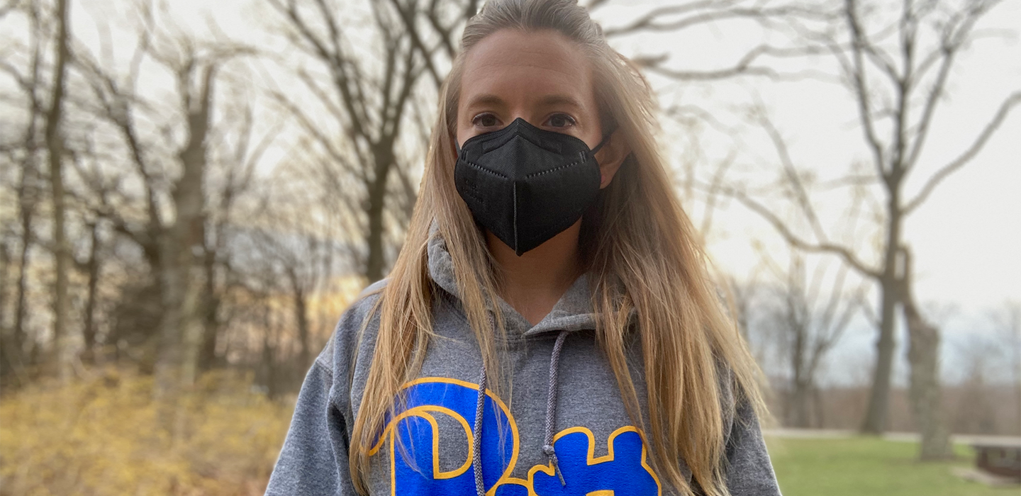 Cary Anderson wearing face mask and grey Pitt hoodie outside