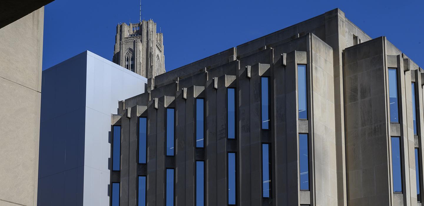Cathedral of Learning towering behind building