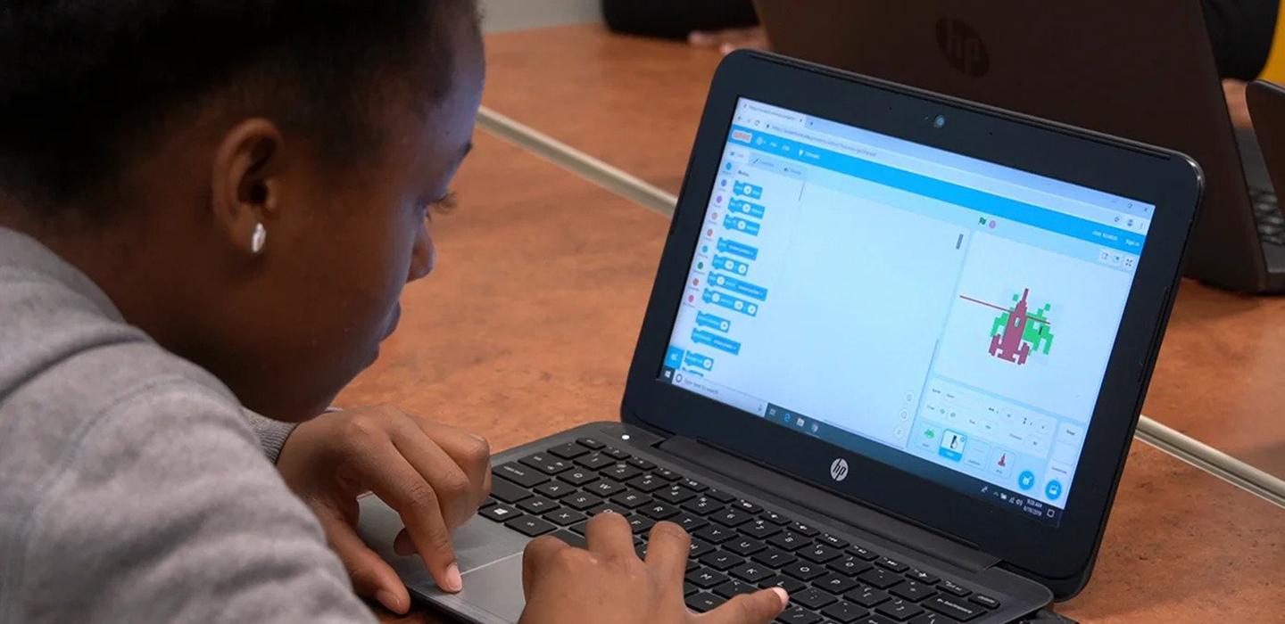 Young girl using laptop