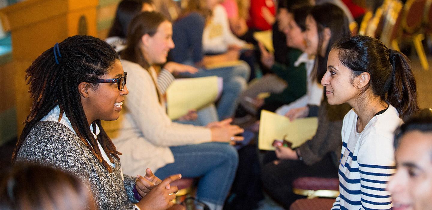 students talking at a speed "friending" event