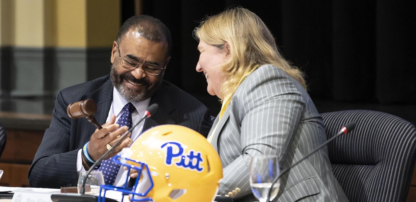 Callahan handing the board gavel to Browning