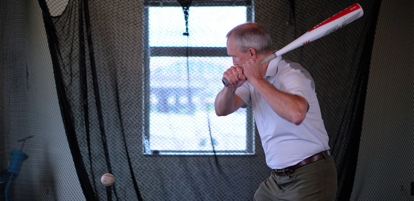 Clark swinging a bat