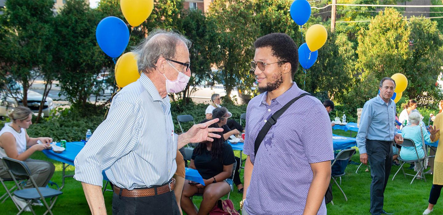 an Oakland resident and a student talking
