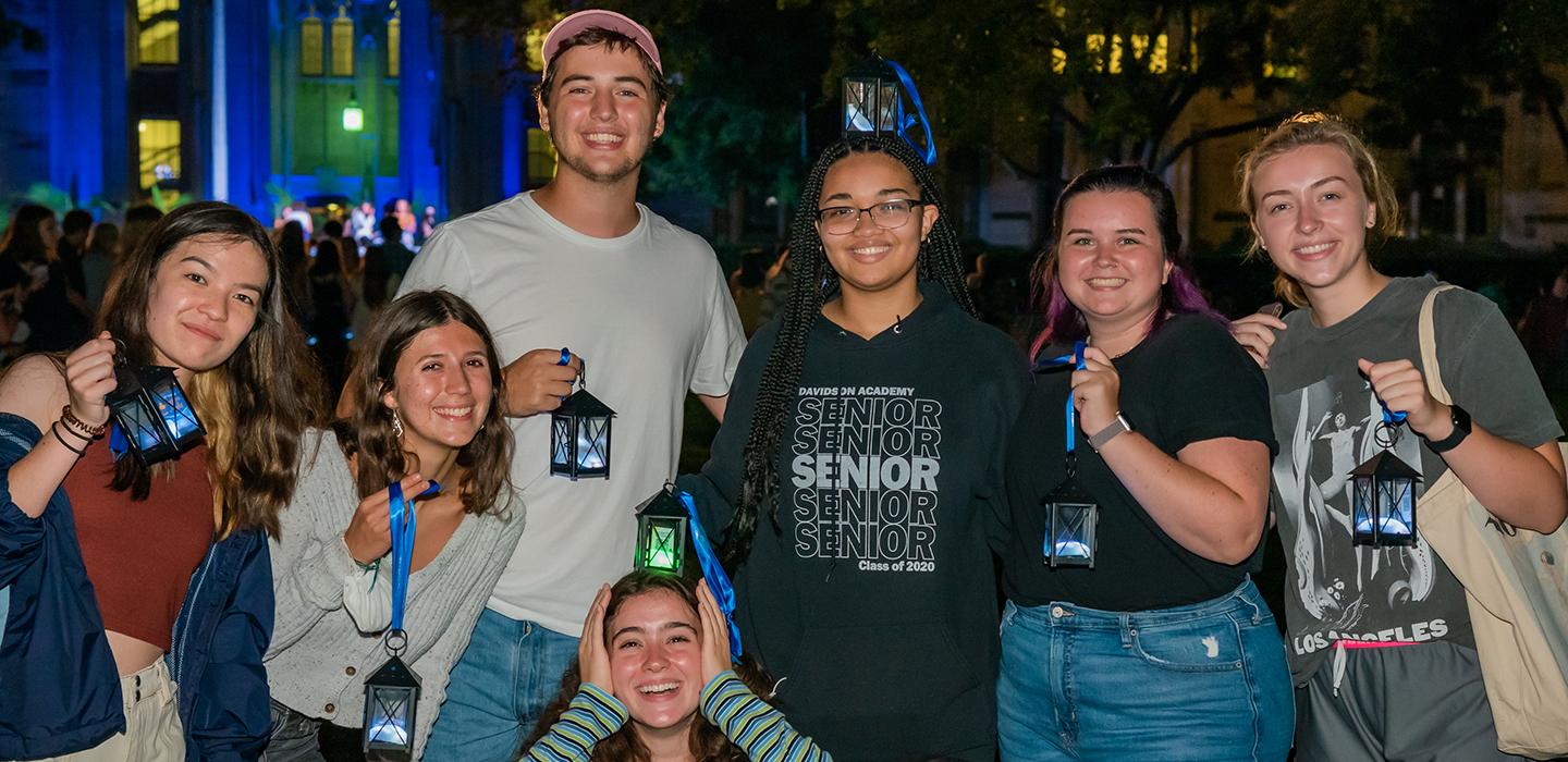 7 students smiling with their lanterns