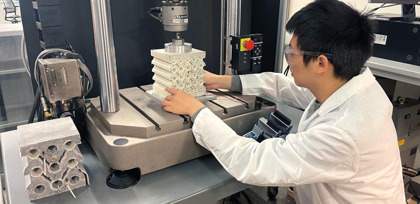 a person in a lab coat at a machine