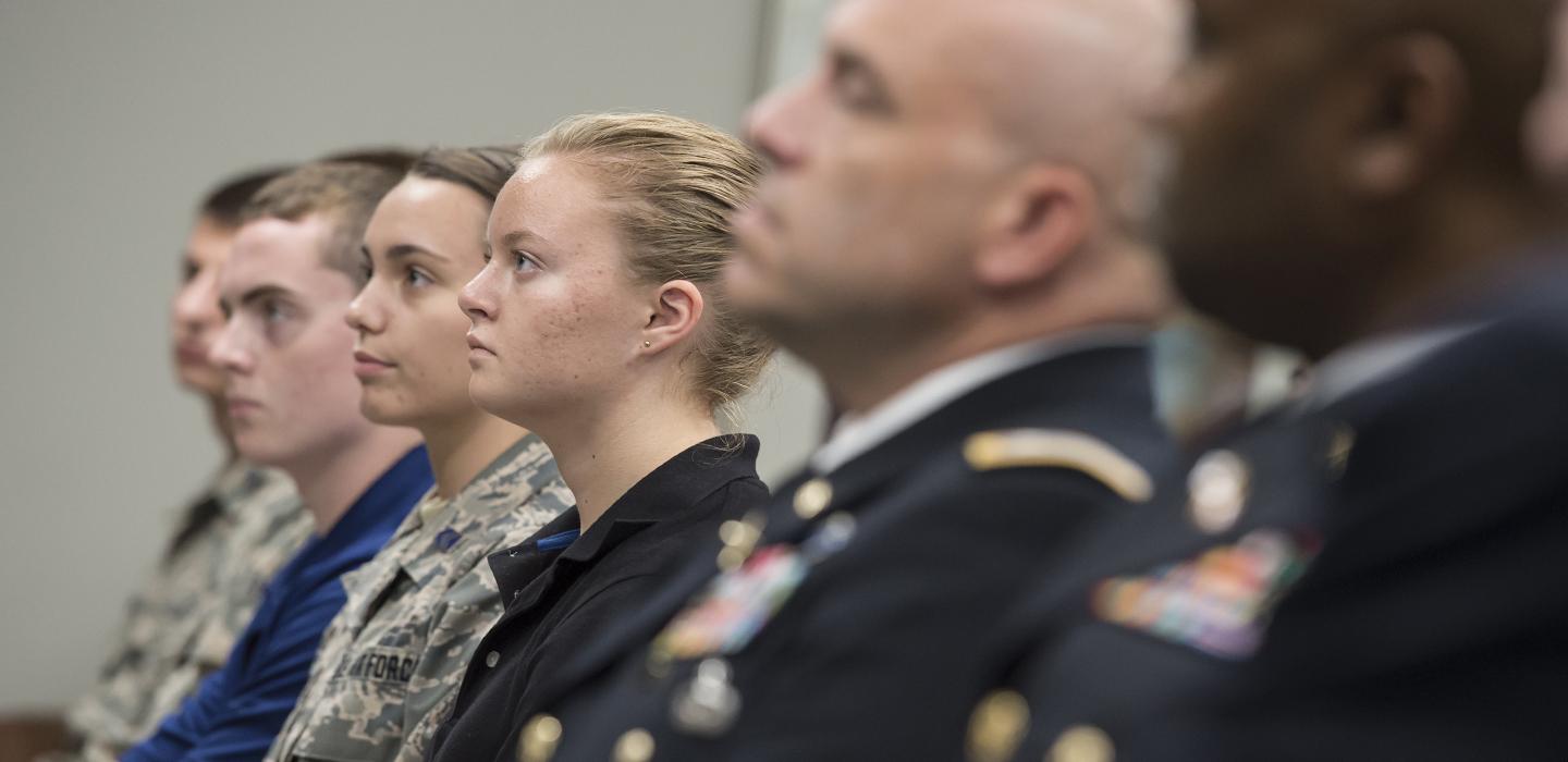 a line of people in military uniforms