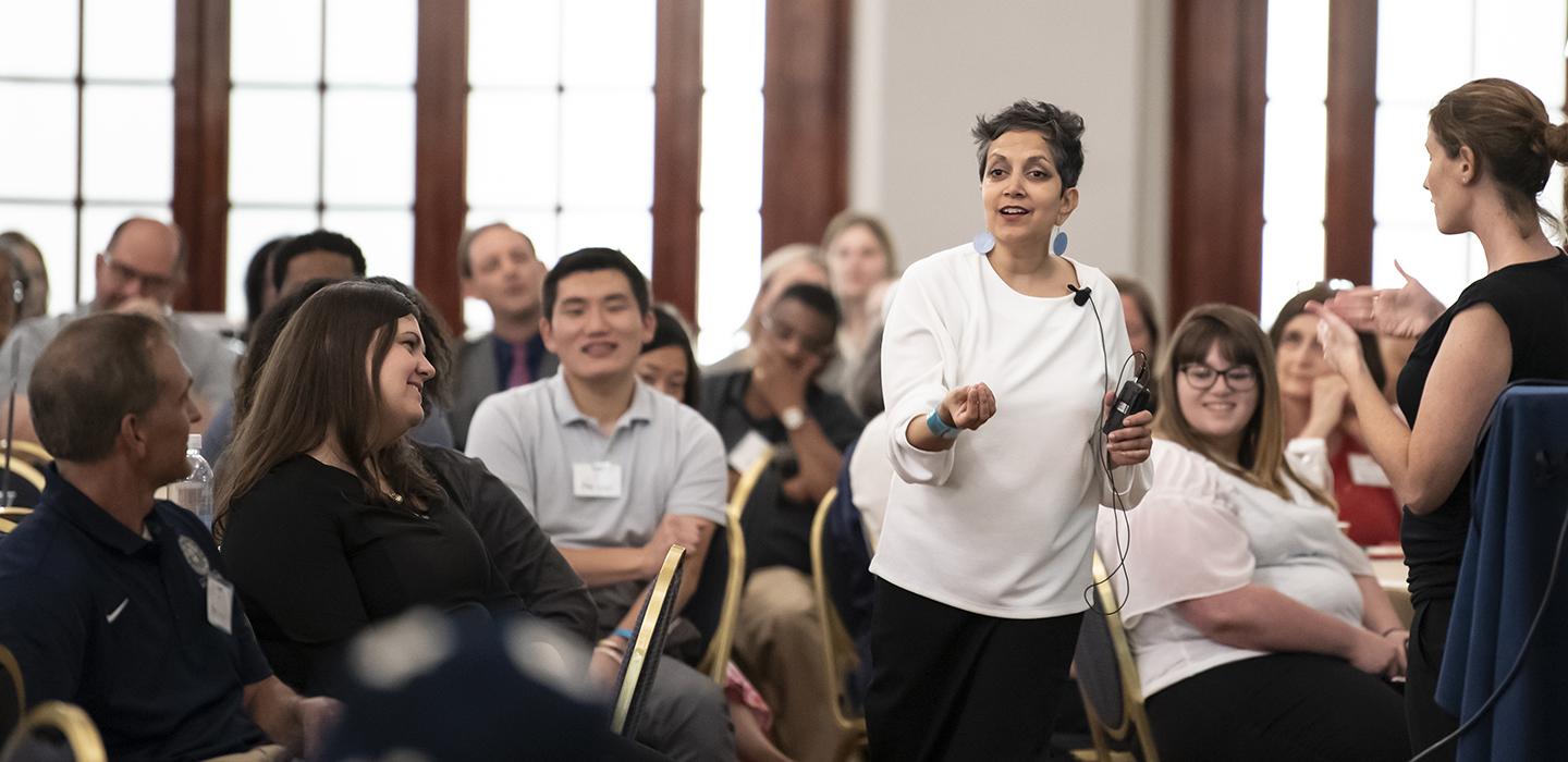 Patel speaking to an animated crowd