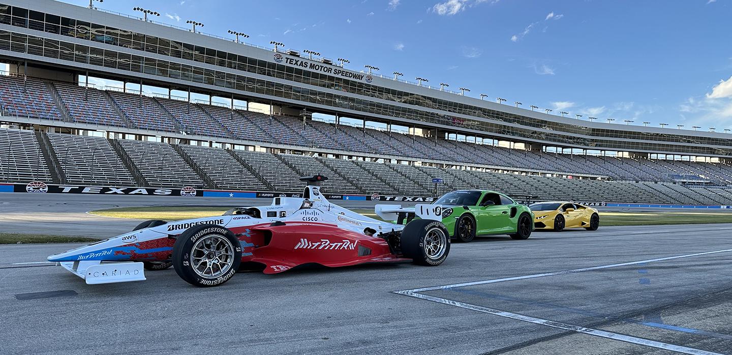 a red and white race car on a track