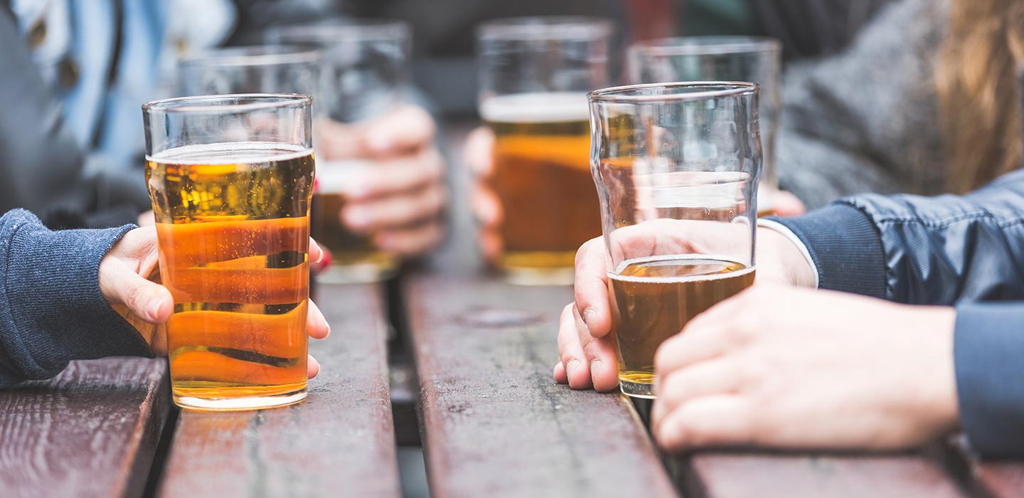 Glasses of beer on a wooden table