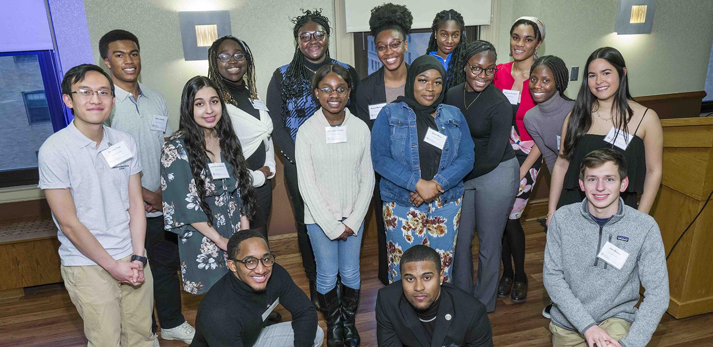 Scholars pose in a group photo