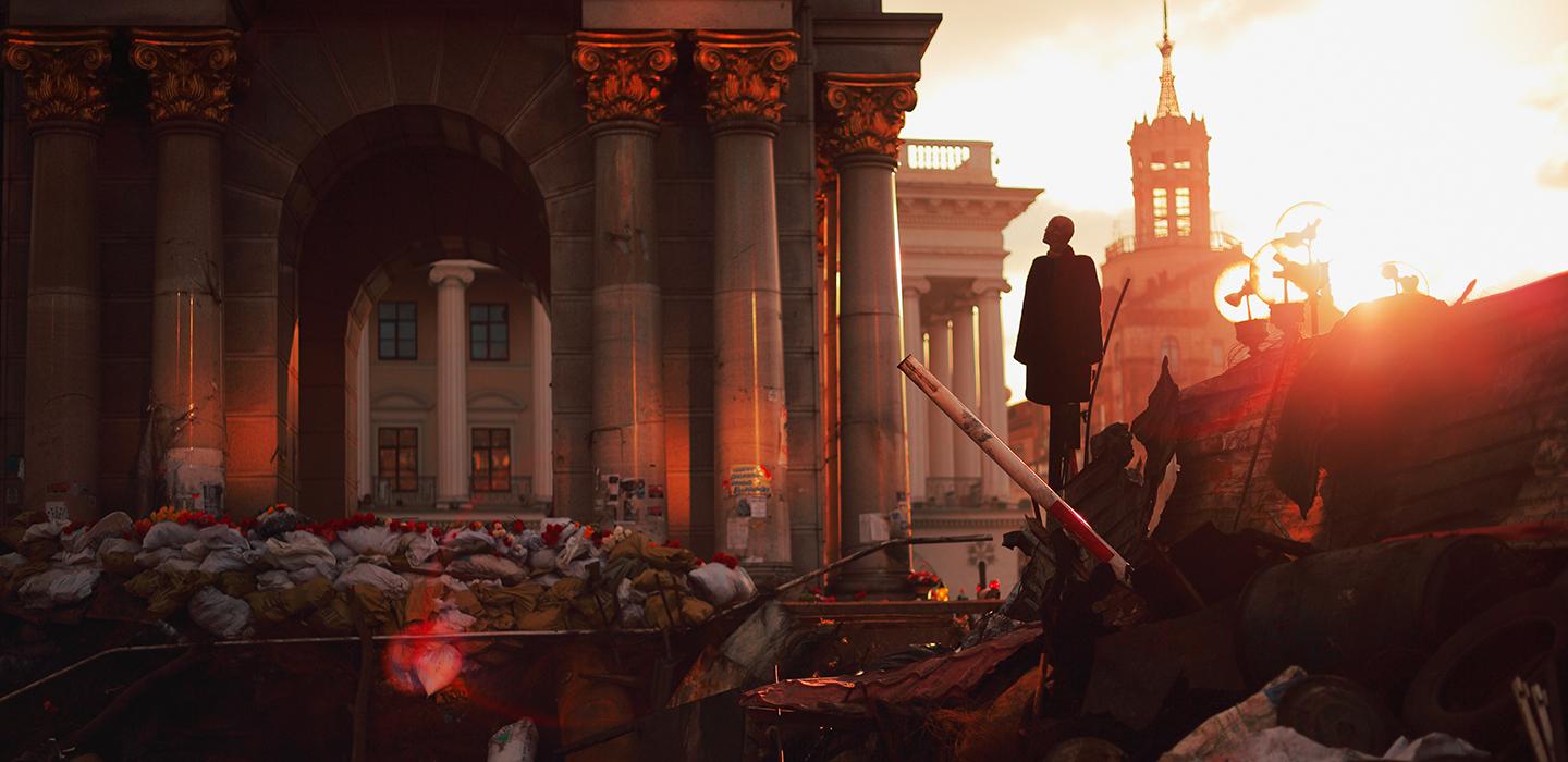 A person stands in the wreckage of a city