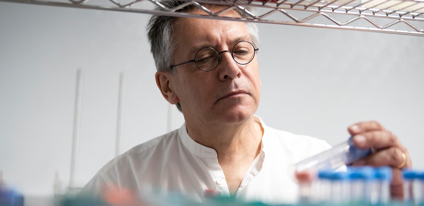 Graham Hatfull looks at a plastic tube